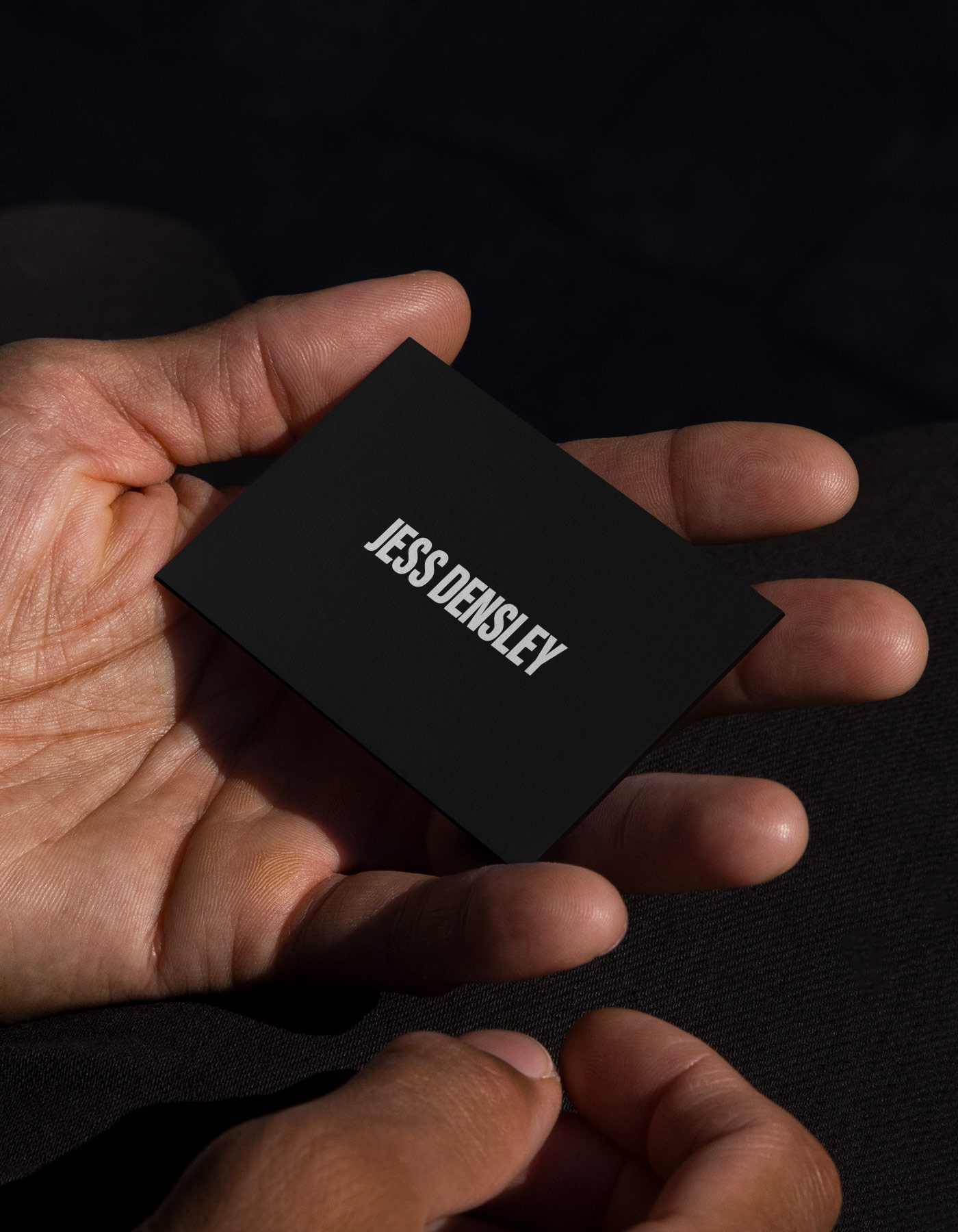 Jess Densley business card in black with white logotype