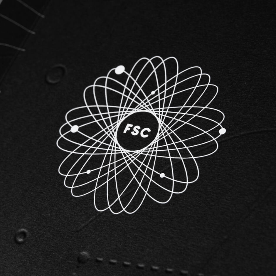 Close-up of FSC orbit logo embossed on black cover
